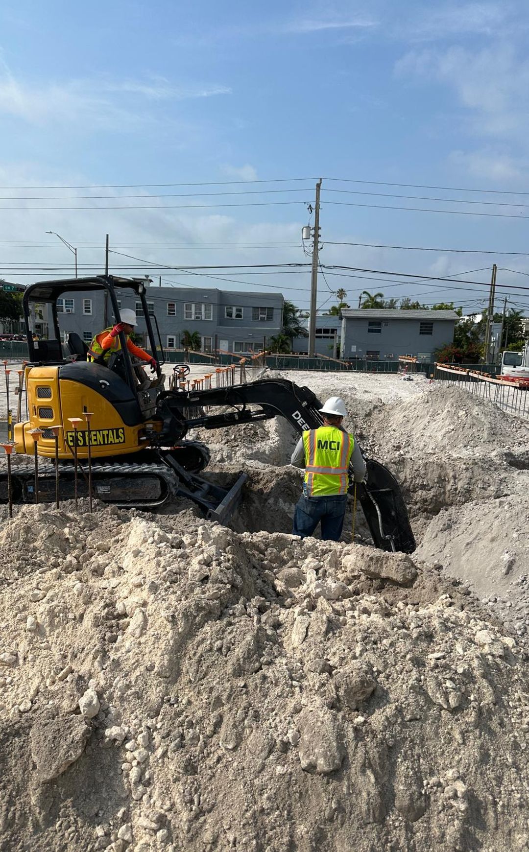 mci employee working on an excavator