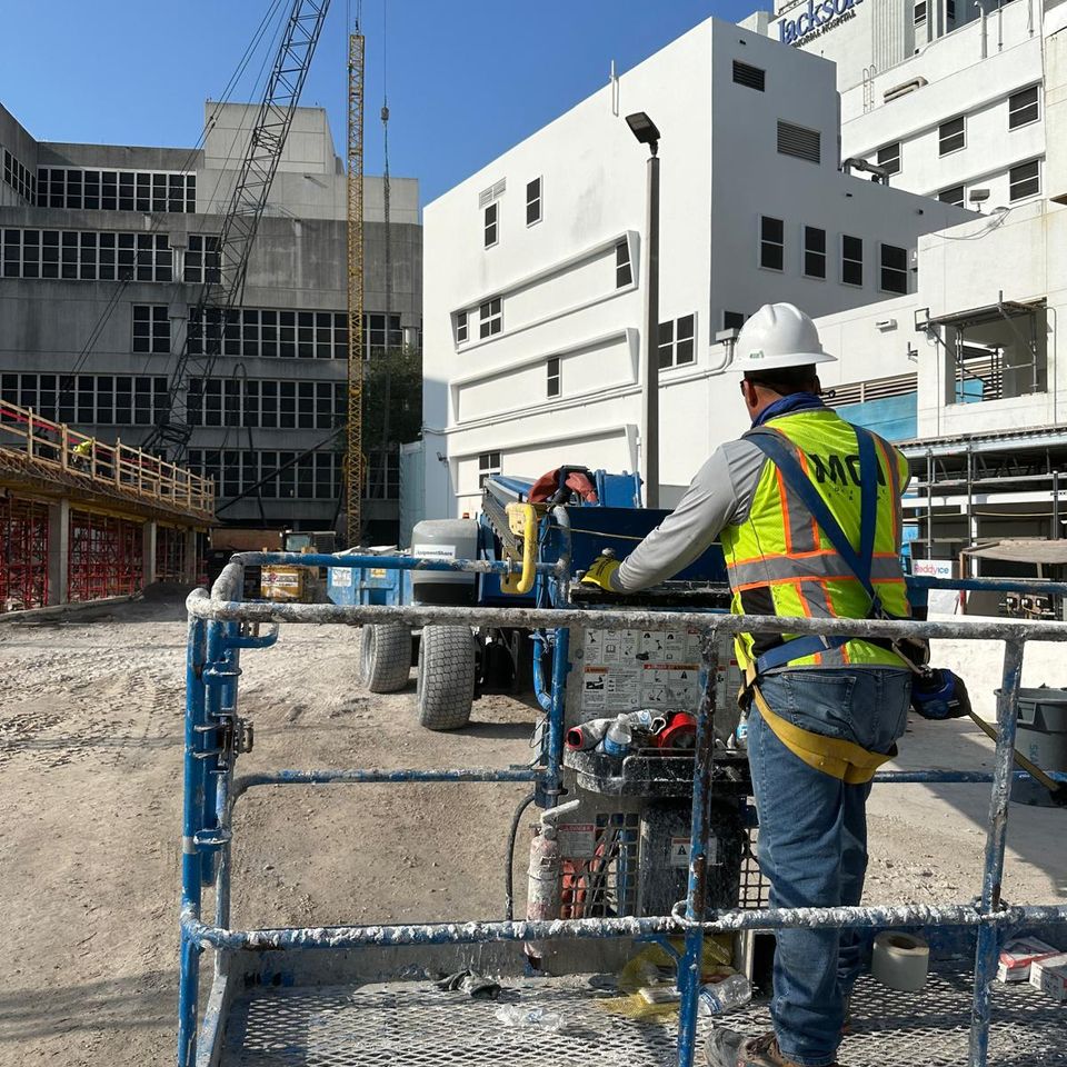 man using an excavator on a worksite